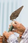 Bricklayer Working In Construction Site Of A Brick Wall Stock Photo