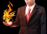 Business Man Holding Fire Flaming On Hand Stock Photo