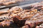 Traditional Meat Grilled On The Grill In The Argentine Countryside Stock Photo