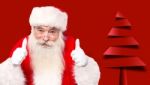 Santa Claus Giving Thumbs Up Gesture Stock Photo