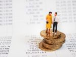 Miniature Couple Stand On Euro Coins. Family Future Money Plan C Stock Photo