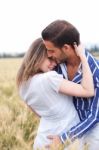 Portrait Of A Young Couple Hugging And Kissing Stock Photo