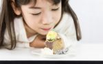 Temptation Girl Eating Cake Stock Photo