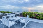 Table And Chairs Set On Balcony Near The Beach Stock Photo