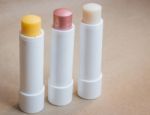 Moisturizer Lipstick On Brown Natural Background Stock Photo