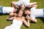 Happy family relaxing in garden Stock Photo