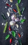 Top View Of Food Ingredients And Condiment On The Table, Ingredients And Seasoning On Dark Wooden Floor Stock Photo