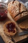 Dark Multigrain Bread Whole Grain And Jam Fresh Baked On Rustic Closeup Stock Photo