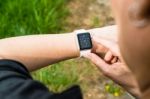 Woman Checking Her Apple Watch Stock Photo