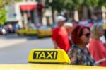 Yellow Taxi Sign On Cab Vehicle Roof Stock Photo