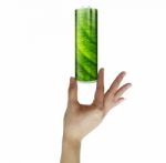 Woman Holding Green Battery Stock Photo