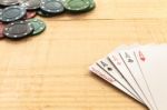 Cards And Poker Chips On Wooden Background Stock Photo