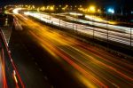 Blurred Darknight Traffic Light Trails On Street Stock Photo