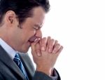 Business Executive Praying To God Stock Photo