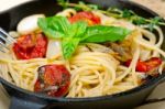 Spaghetti Pasta With Baked Cherry Tomatoes And Basil Stock Photo