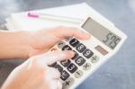 Hands Holding And Press Calculator Stock Photo