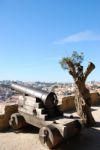 Cityscape Of Lisbon In Portugal With Cannon Weapon Stock Photo