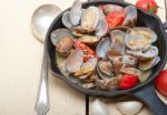 Fresh Clams On An Iron Skillet Stock Photo