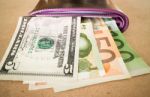 International Currencies Bank Note In The Wallet Stock Photo