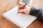 Woman Hand With Pen Writing On Notebook Stock Photo