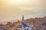 Instagram Filter Young Man Asia Tourist At Mountain Is Watching Over The Misty And Foggy Morning Sunrise, Travel Trekking Stock Photo