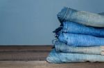 Blue Jean And Jean Lack Texture On The Wooden Floor Stock Photo