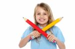 Charming School Girl Posing With Big Pencils Stock Photo