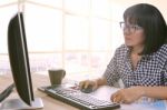 Working Woman Work On Office Computer And Writing Paper Report Stock Photo