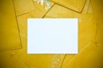 White Sheet Among Yellow Envelope Stock Photo