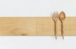 Wooden Fork And Spoon On Wooden Plate Stock Photo