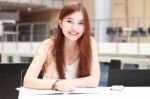 Portrait Of Thai Adult Beautiful Girl Write A Book And Smile In University Stock Photo