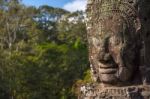 Ancient Stone Face Of Bayon Temple Stock Photo