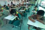 Activity Of Teaching Elementary Students. Elementary Students Are Test Lesson. The Students Intend Exam Stock Photo