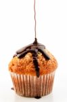 Muffin With Liquid Chocolate Stock Photo