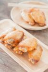 Grilled Chicken Wings On Wooden Plate Stock Photo