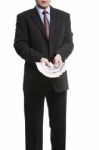 Businessman In Dark Suit With A Bunch Of British Pounds Sterling Stock Photo