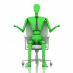 Businessman Doll Sitting On Chair Stock Photo