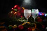 Two Glasses Of Champagne With A Christmas Decor In The Background Stock Photo