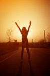 Woman Exercising Outdoor At Sunset  Stock Photo