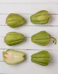 Chayote Fruit On White Wood Background Stock Photo