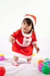 Little Girl With Santa Costume Stock Photo