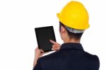 Worker Operating Tablet Device, Back Pose Stock Photo