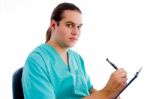 Male Surgeon Writing Prescription Stock Photo