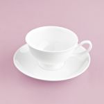 White Cup On Pink Background Solid Stock Photo