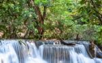 The Water Flowing Over Rocks And Trees Down A Waterfall At Huay Mae Khamin Waterfall National Park ,kanchana Buri In Thailand Stock Photo