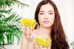 Woman Holding Two Bowl Full Of Fruit Stock Photo