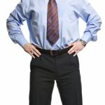 Businessman In Blue Shirt Stands With Hands On The Waist Stock Photo