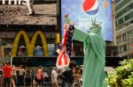 Manhattan, New York - June, 2016 Living Statue Man Performance As Statue Of Liberty With American Flag At Times Square For Celebrate Before Independence Day Of The United States, July 4th Stock Photo