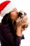 Female With Hat And Kissing Puppy Stock Photo