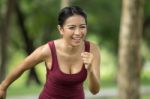 Woman Is Jogging Stock Photo